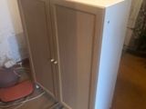 a cabinet that is sitting in the middle of a room
