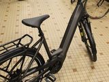 many bikes that are parked on the floor in the store