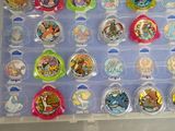 many different types of plastic toys in this display case