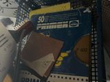 a pile of papers and other items on a shelf
