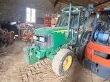 a tractor that is parked inside of a building