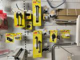 many tools hanging on a pegboard in a store