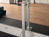 a large mirror in the middle of a gym room