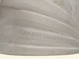 a close up of a white vase on a white background