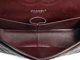 a close up of a chanel bag with a handle