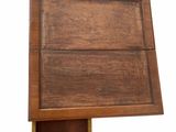a small wooden box with a shelf on top of it