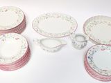 a lot of plates and cups on the table