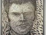a black and white photo of a man ' s face made out of pebbles
