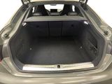 a trunk of a car with the back door open
