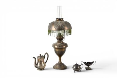 a small lamp and a teapot next to a teapot