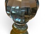 a close up of a glass knob on a white background