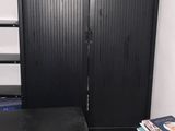 a small room with a bed and a desk