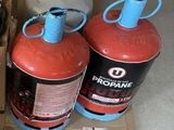 boxes of propanex and propanex gas are on the floor