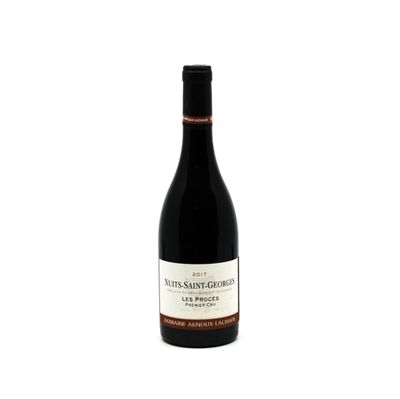 a bottle of wine sitting on top of a white table