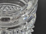 a close up of a clear glass vase on a table