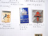 several different badges on a piece of paper on a table