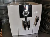 a coffee machine sitting on a counter in a kitchen