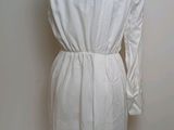 an image of a white shirt dress on a mannequin