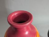 two vases sitting next to each other on a table