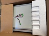 a box with a computer and wires inside of it