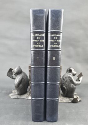 two books that are sitting next to each other on a table