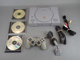 a video game system with two controllers and a game disc