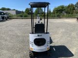 an image of a small construction vehicle parked in a parking lot