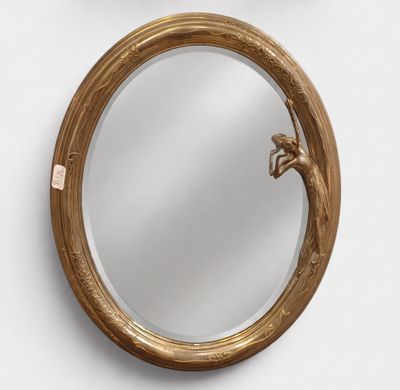 a round mirror with a bird on it and a bird on the mirror