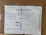 a certificate on a piece of paper on a table