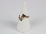silver and gold ring with a yellow diamond