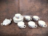 a group of cups and saucers on a table