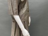 an image of a mannequin wearing a brown dress and hat