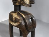 an image of a wooden sculpture of a horse on a white surface