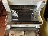 a machine that is sitting on a cart in the kitchen