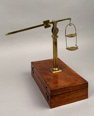 a wooden box with a scale on it and a wooden box with a scale on it