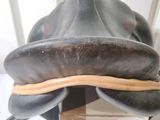 a close up of a horse ' s saddle with a leather cover on it