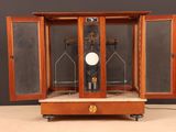 a clock in the middle of a wooden case