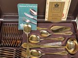 a box with a bunch of silverware in it