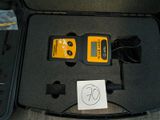 a box with two cables and a remote control in it