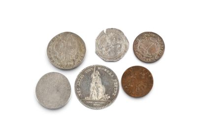 six different types of coins are shown on a white surface