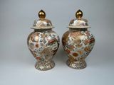pair of antique chinese vases with lids on a white background