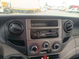a dashboard of a car with a radio and a steering wheel