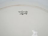 a close up of a white plate with writing on it