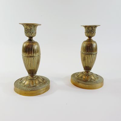 pair of antique brass candlesticks on marble bases