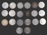une image représentant un tas de pièces posées sur une surface noire