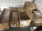 many boxes of bread sitting on a shelf in a kitchen