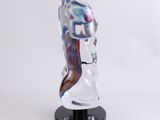 a glass sculpture of a woman ' s head on a black base