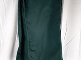 green skirt hanging on a green hanger on a white sheet