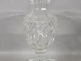 a glass vase that is sitting on top of a table