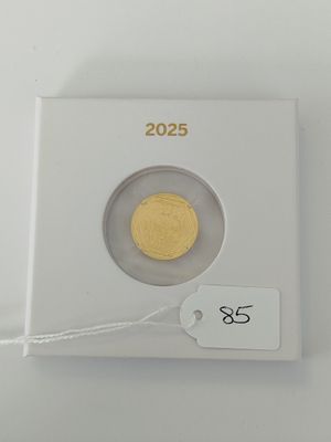 a close up of a coin in a white box with a price tag